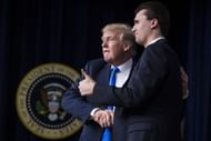 President Donald J. Trump shakes hands with Charlie Kirk (Image via Getty)